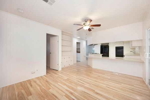 Empty room, Fireplace, Interior, Kitchen, Recessed Lighting, Wood Texture Flooring
