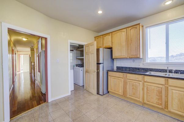 Interior, Kitchen, Recessed Lighting, Washer, Wood Texture Flooring
