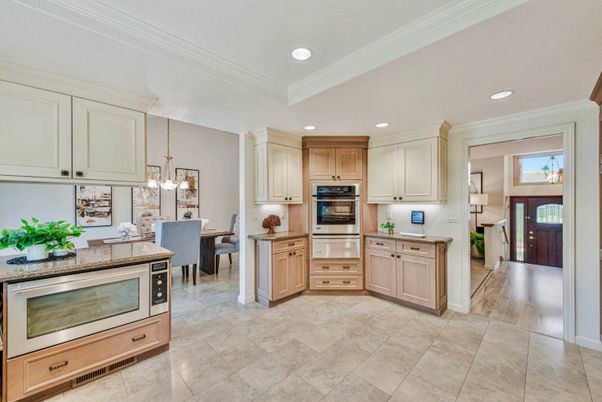Chandelier, Dining room, Interior, Kitchen, Pendant Lights, Recessed Lighting, Stainless Steel Appliances, Wood Texture Flooring
