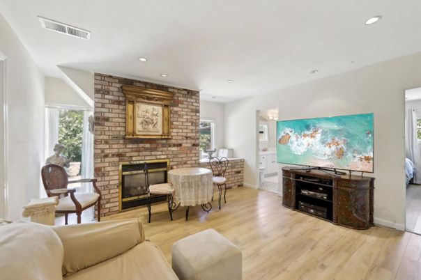 Fireplace, Interior, Living room, Recessed Lighting, Stone Walls, Wood Texture Flooring