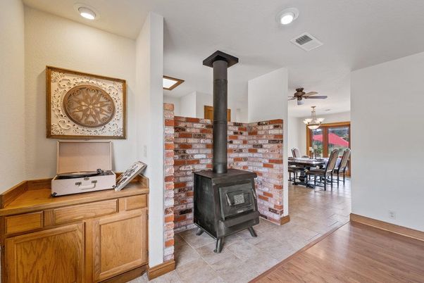 Chandelier, Dining room, Fireplace, Interior, Recessed Lighting, Wood Texture Flooring