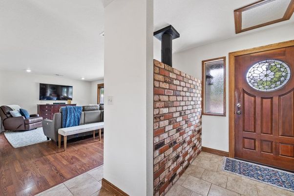 Fireplace, Interior, Living room, Recessed Lighting, Stone Walls, Wood Texture Flooring