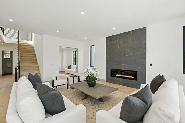 Fireplace, Interior, Living room, Marble Walls, Recessed Lighting, Wood Texture Flooring
