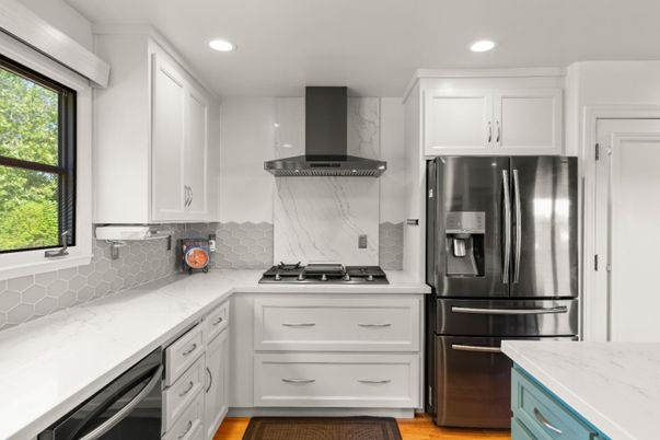 Interior, Kitchen, Marble Walls, Recessed Lighting, Stainless Steel Appliances, Wood Texture Flooring