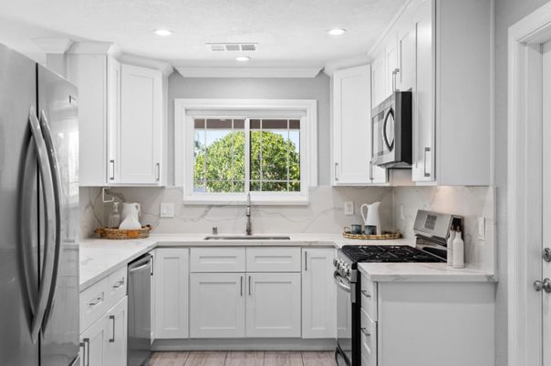 Interior, Kitchen, Marble Walls, Recessed Lighting, Stainless Steel Appliances