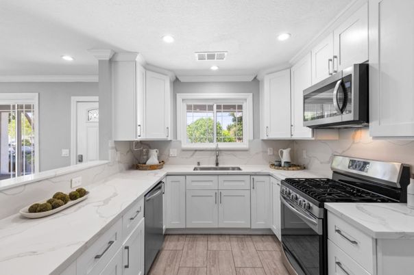 Interior, Kitchen, Marble Walls, Recessed Lighting, Stainless Steel Appliances, Wood Texture Flooring