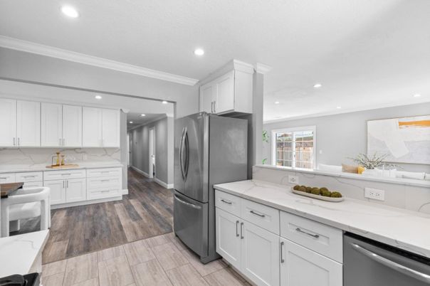 Interior, Kitchen, Marble Walls, Recessed Lighting, Stainless Steel Appliances, Wood Texture Flooring