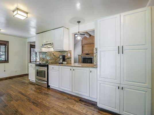 Fireplace, Interior, Kitchen, Stainless Steel Appliances, Stone Walls, Wood Texture Flooring