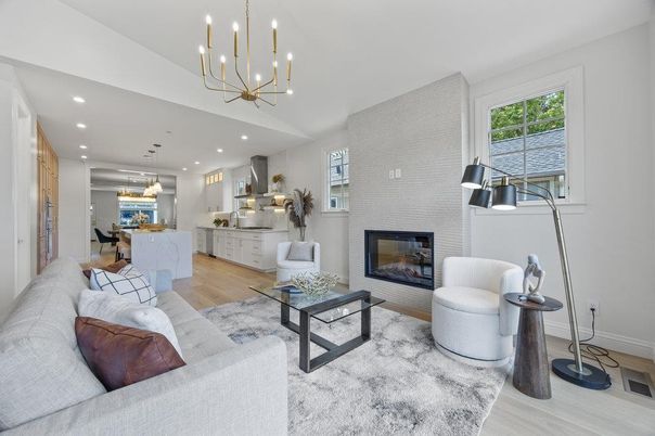 Chandelier, Dining room, Fireplace, Interior, Kitchen, Living room, Pendant Lights, Recessed Lighting, Stainless Steel Appliances, Stone Walls, Wood Texture Flooring