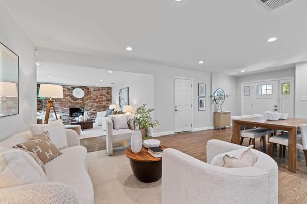 Dining room, Fireplace, Interior, Living room, Recessed Lighting, Stone Walls, Wood Texture Flooring