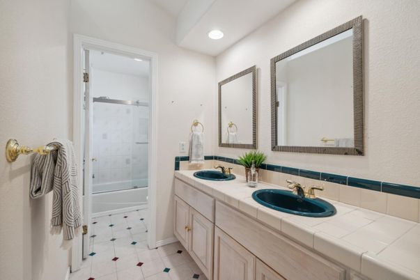 Bathroom, Dual Sink Vanities, Glass Shower, Interior, Recessed Lighting, Tile Countertops