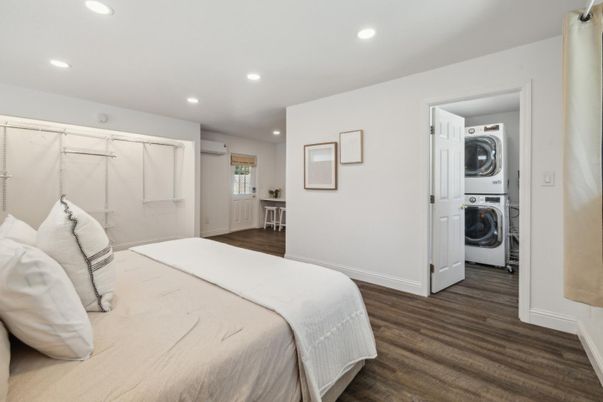 Bedroom, Interior, Recessed Lighting, Utility Closets, Washer, Wood Texture Flooring