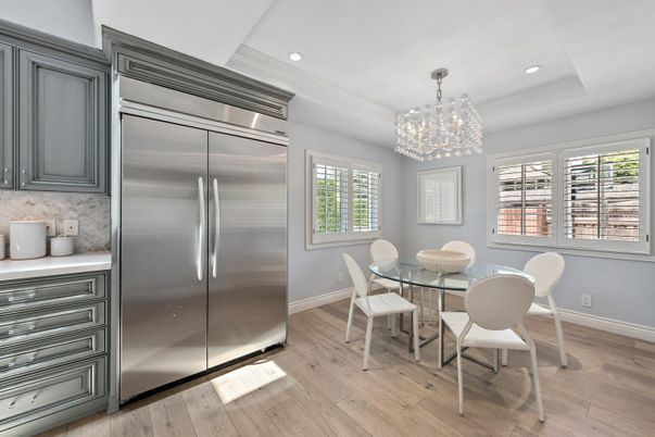 Chandelier, Dining room, Interior, Recessed Lighting, Stainless Steel Appliances, Wood Texture Flooring