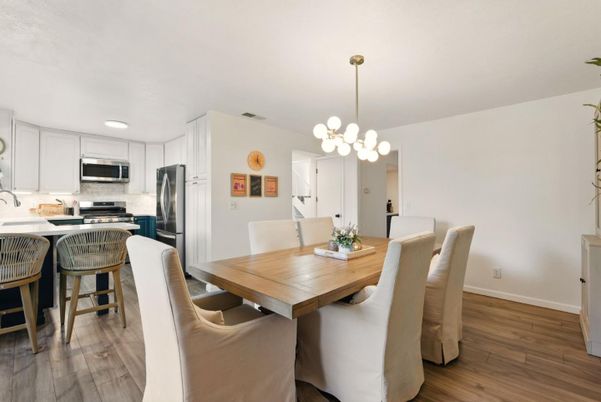 Dining room, Interior, Kitchen, Pendant Lights, Recessed Lighting, Stainless Steel Appliances, Wood Texture Flooring