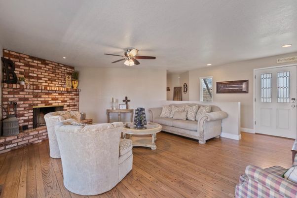 Fireplace, Interior, Living room, Recessed Lighting, Stone Walls, Wood Texture Flooring