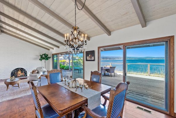 Chandelier, Dining room, Fireplace, Interior, Living room, Stone Walls, Water, Wooden Beams, Wood Texture Flooring