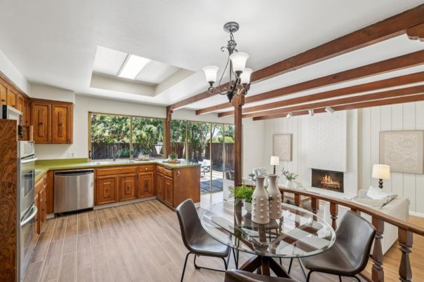 Chandelier, Dining room, Fireplace, Interior, Kitchen, Stainless Steel Appliances, Wooden Beams, Wood Texture Flooring