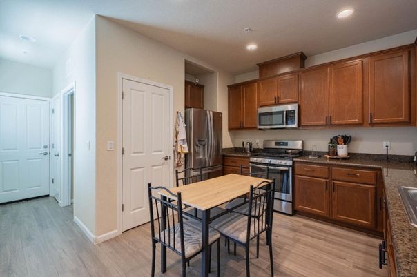 Dining room, Interior, Kitchen, Recessed Lighting, Stainless Steel Appliances, Wood Texture Flooring