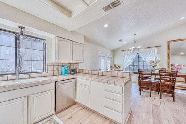 Chandelier, Dining room, Interior, Kitchen, Recessed Lighting, Tile Countertops, Wood Texture Flooring