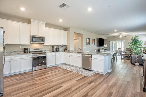 Dining room, Interior, Kitchen, Recessed Lighting, Stainless Steel Appliances, Wood Texture Flooring