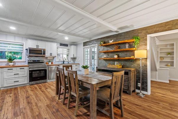Dining room, Interior, Kitchen, Recessed Lighting, Stainless Steel Appliances, Stone Walls, Wood Texture Flooring