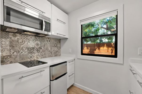 Fireplace, Interior, Kitchen, Stainless Steel Appliances, Wood Texture Flooring