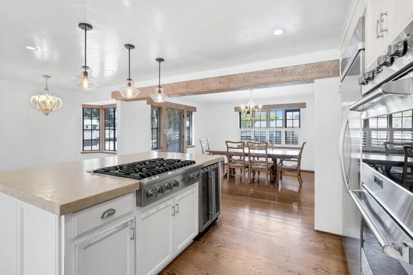 Chandelier, Dining room, Interior, Kitchen, Pendant Lights, Recessed Lighting, Stainless Steel Appliances, Wood Texture Flooring