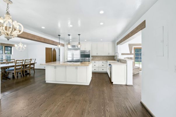 Chandelier, Dining room, Interior, Kitchen, Pendant Lights, Recessed Lighting, Stainless Steel Appliances, Wooden Beams, Wood Texture Flooring