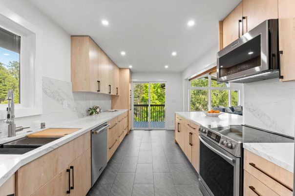 Interior, Kitchen, Marble Walls, Recessed Lighting, Stainless Steel Appliances
