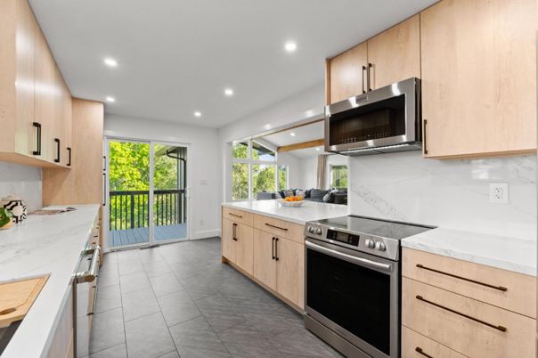 Interior, Kitchen, Marble Walls, Recessed Lighting, Stainless Steel Appliances