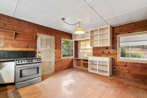 Empty room, Interior, Kitchen, Stainless Steel Appliances, Wood Texture Flooring, Wooden Walls