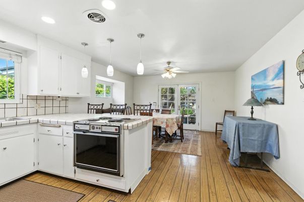 Dining room, Interior, Kitchen, Pendant Lights, Recessed Lighting, Tile Countertops, Wood Texture Flooring