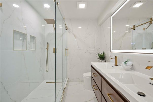 Bathroom, Dual Sink Vanities, Glass Shower, Interior, Marble, Marble Walls, Recessed Lighting