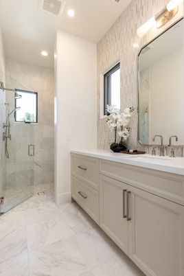 Bathroom, Dual Sink Vanities, Glass Shower, Interior, Marble, Marble Walls, Recessed Lighting