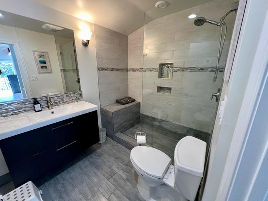 Bathroom, Dual Sink Vanities, Glass Shower, Interior, Recessed Lighting, Wood Texture Flooring