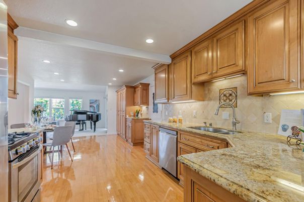 Dining room, Interior, Kitchen, Piano, Recessed Lighting, Stainless Steel Appliances, Wood Texture Flooring