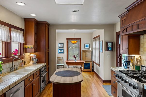 Interior, Kitchen, Pendant Lights, Recessed Lighting, Stainless Steel Appliances, Tile Countertops, Wood Texture Flooring