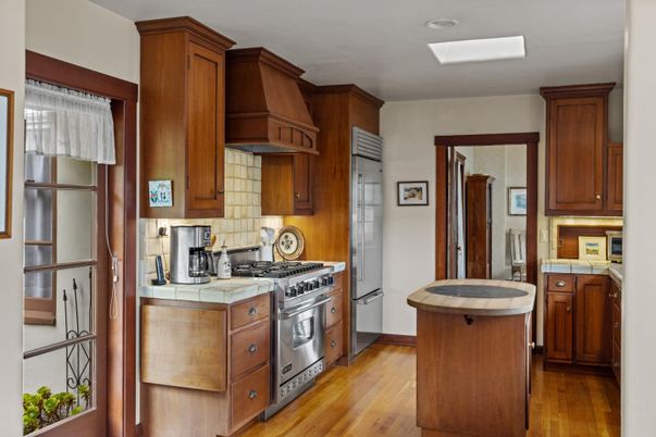 Interior, Kitchen, Recessed Lighting, Stainless Steel Appliances, Tile Countertops, Wood Texture Flooring