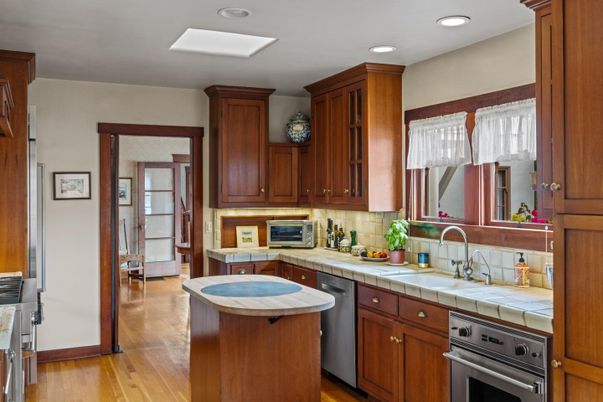 Interior, Kitchen, Recessed Lighting, Stainless Steel Appliances, Tile Countertops, Wood Texture Flooring