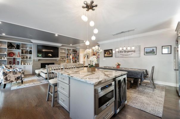 Dining room, Fireplace, Interior, Kitchen, Living room, Pendant Lights, Recessed Lighting, Stainless Steel Appliances, Wood Texture Flooring