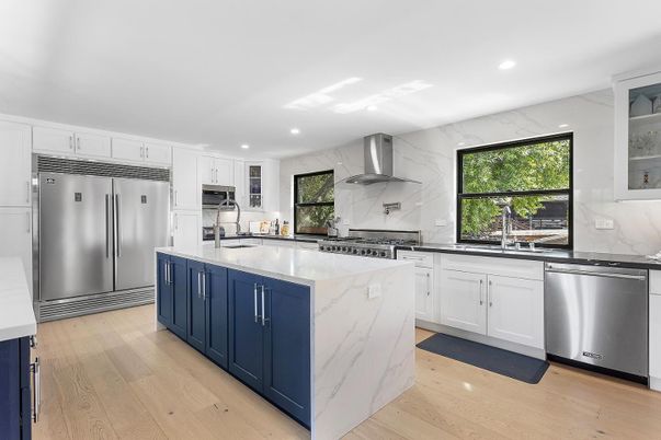 Interior, Kitchen, Marble Walls, Recessed Lighting, Stainless Steel Appliances, Wood Texture Flooring