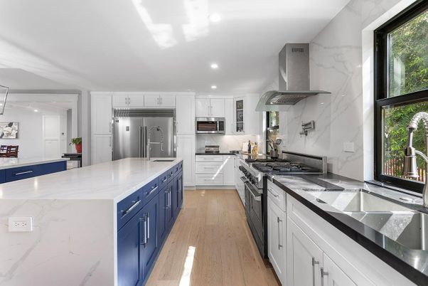 Interior, Kitchen, Marble Walls, Recessed Lighting, Stainless Steel Appliances, Wood Texture Flooring