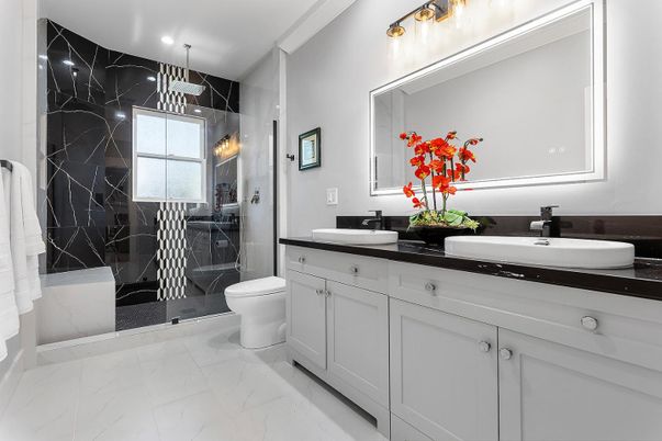 Bathroom, Dual Sink Vanities, Glass Shower, Interior, Marble, Marble Walls, Pendant Lights, Recessed Lighting