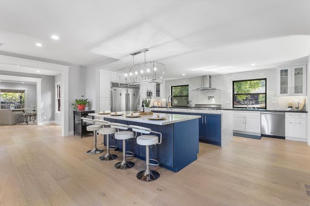 Interior, Kitchen, Marble Walls, Pendant Lights, Recessed Lighting, Stainless Steel Appliances, Wood Texture Flooring
