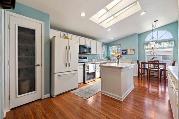 Dining room, Interior, Kitchen, Pendant Lights, Recessed Lighting, Stainless Steel Appliances, Wood Texture Flooring