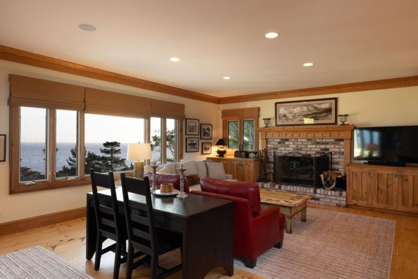 Dining room, Fireplace, Interior, Living room, Recessed Lighting, Water, Wood Texture Flooring