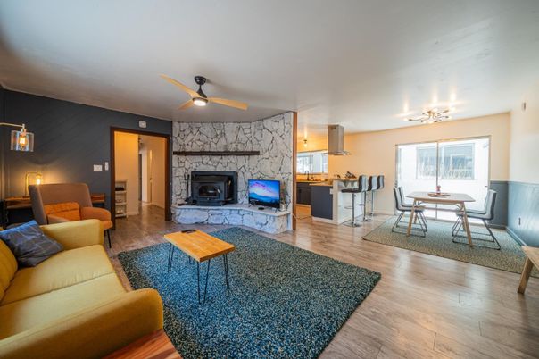 Dining room, Fireplace, Interior, Kitchen, Living room, Pendant Lights, Stone Walls, Wood Texture Flooring