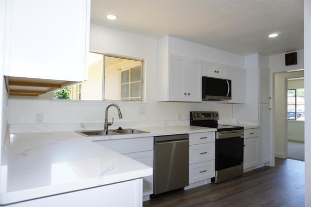 Interior, Kitchen, Recessed Lighting, Stainless Steel Appliances, Wood Texture Flooring
