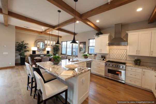 Chandelier, Dining room, Interior, Kitchen, Pendant Lights, Recessed Lighting, Stainless Steel Appliances, Wooden Beams, Wood Texture Flooring