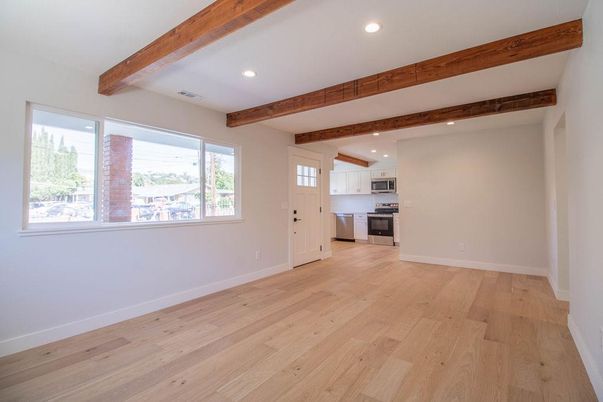 Empty room, Interior, Kitchen, Recessed Lighting, Stainless Steel Appliances, Wooden Beams, Wood Texture Flooring